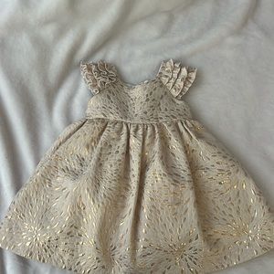 Laura Ashley toddler dress with cream and gold detail.
